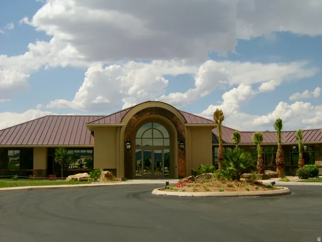 Distinctive curved entry facade with arched glass doors and sidelights anchors this contemporary residence