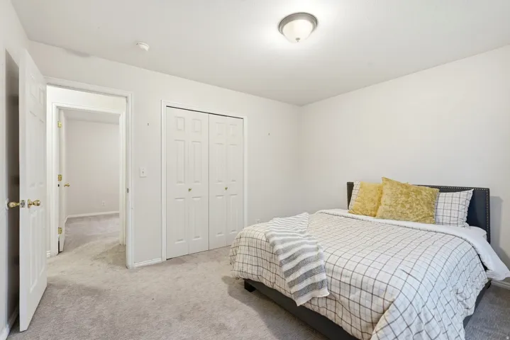 Neutral tone carpeting throughout