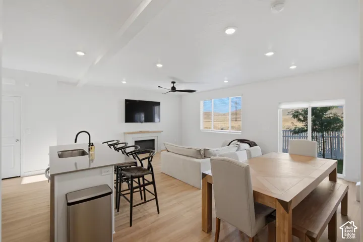 Open-concept living space featuring wood-finish flooring throughout