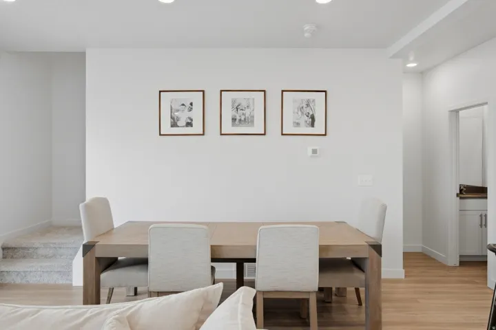 Open-concept living space with recessed lighting and light wood-finish flooring