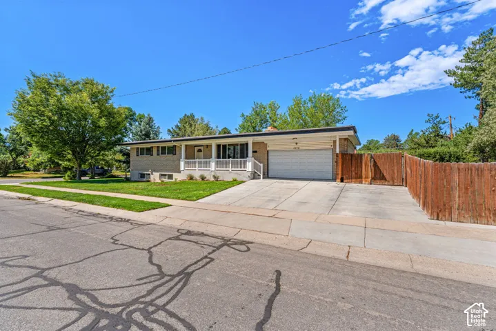 Holladay Brick Rambler. Corner Lot. Mature Trees. RV Parking (in front and behind fence). Basement / Mother-In-Law Apartment.