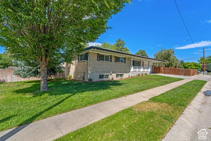Holladay Brick Rambler. Corner Lot. Mature Trees. RV Parking (in front and behind fence). Basement / Mother-In-Law Apartment.