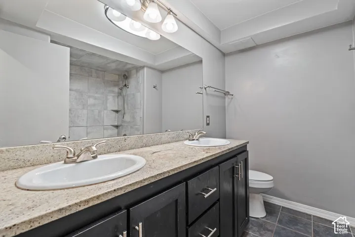 Double vanity with granite-style countertop and integrated sinks