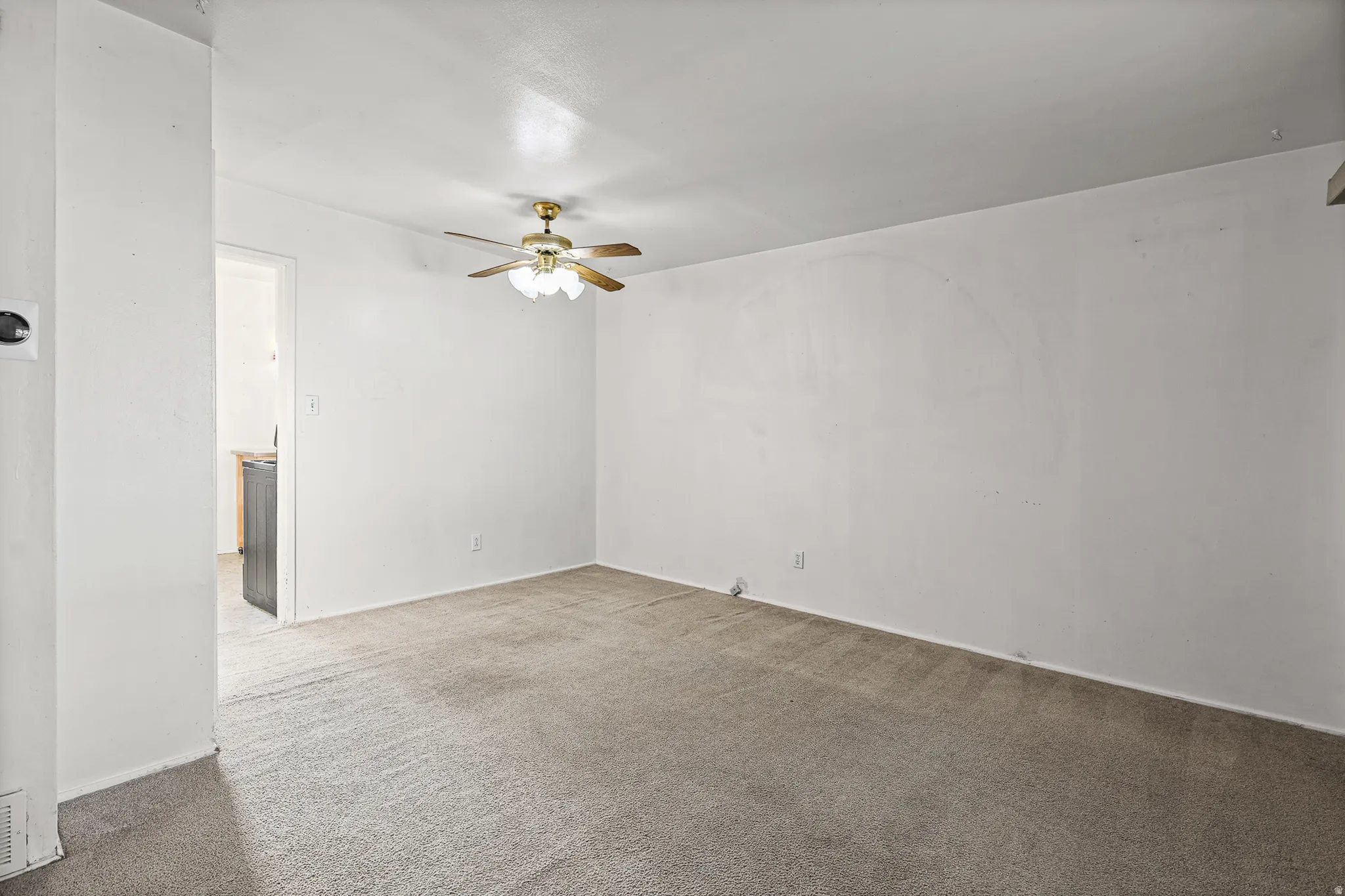 Neutral wall color with a ceiling fan