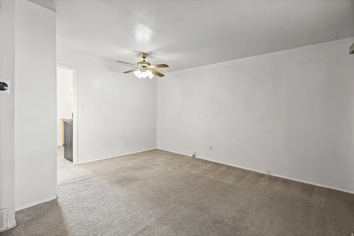 Neutral wall color with a ceiling fan