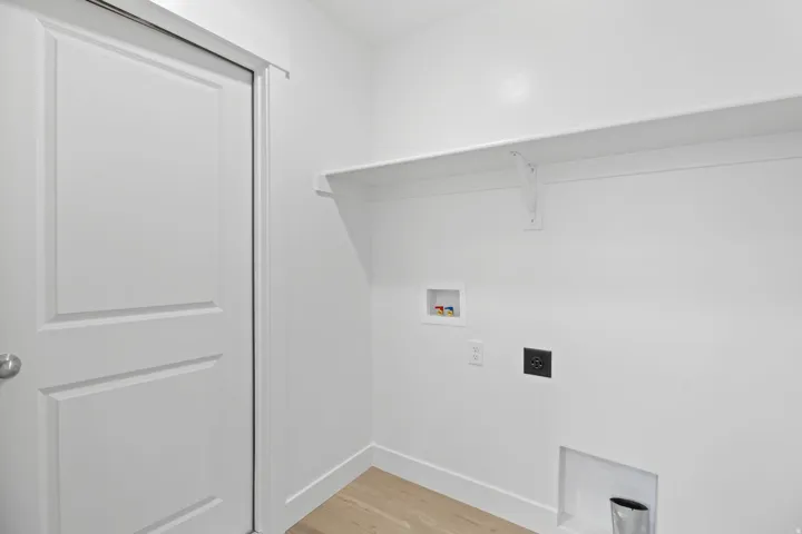 Dedicated utility space featuring a neutral color palette