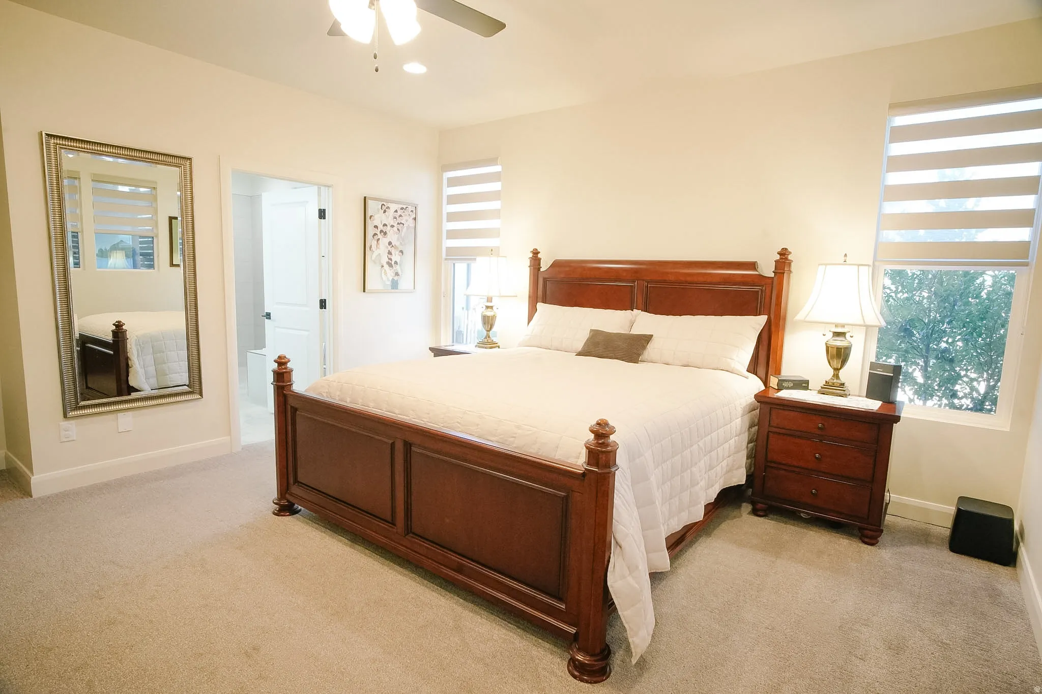 Primary Bedroom featuring a ceiling fan, recessed lighting, and dual windows with horizontal blinds