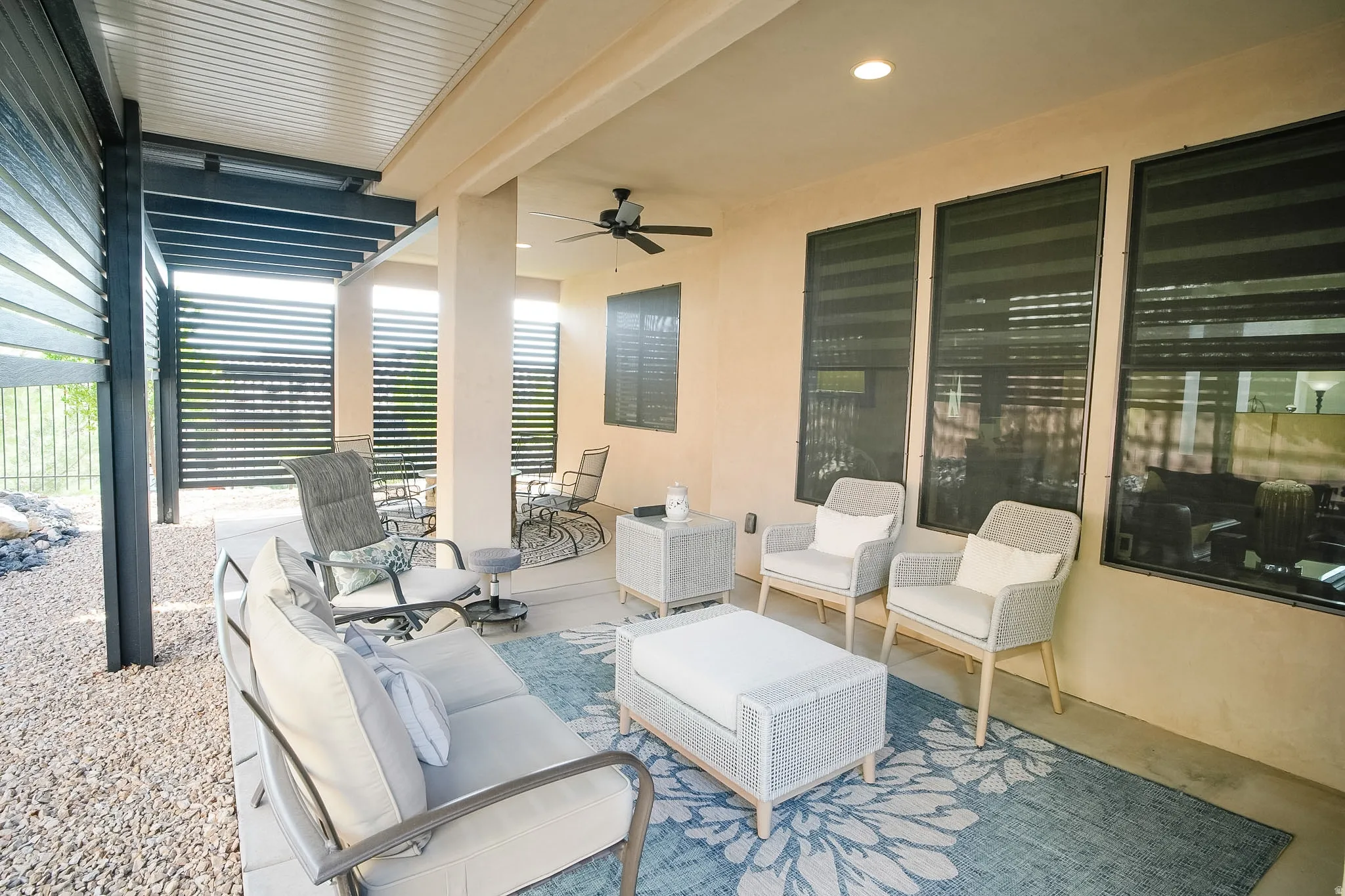 Covered patio with a ceiling fan, recessed lighting, and a stucco exterior wall
