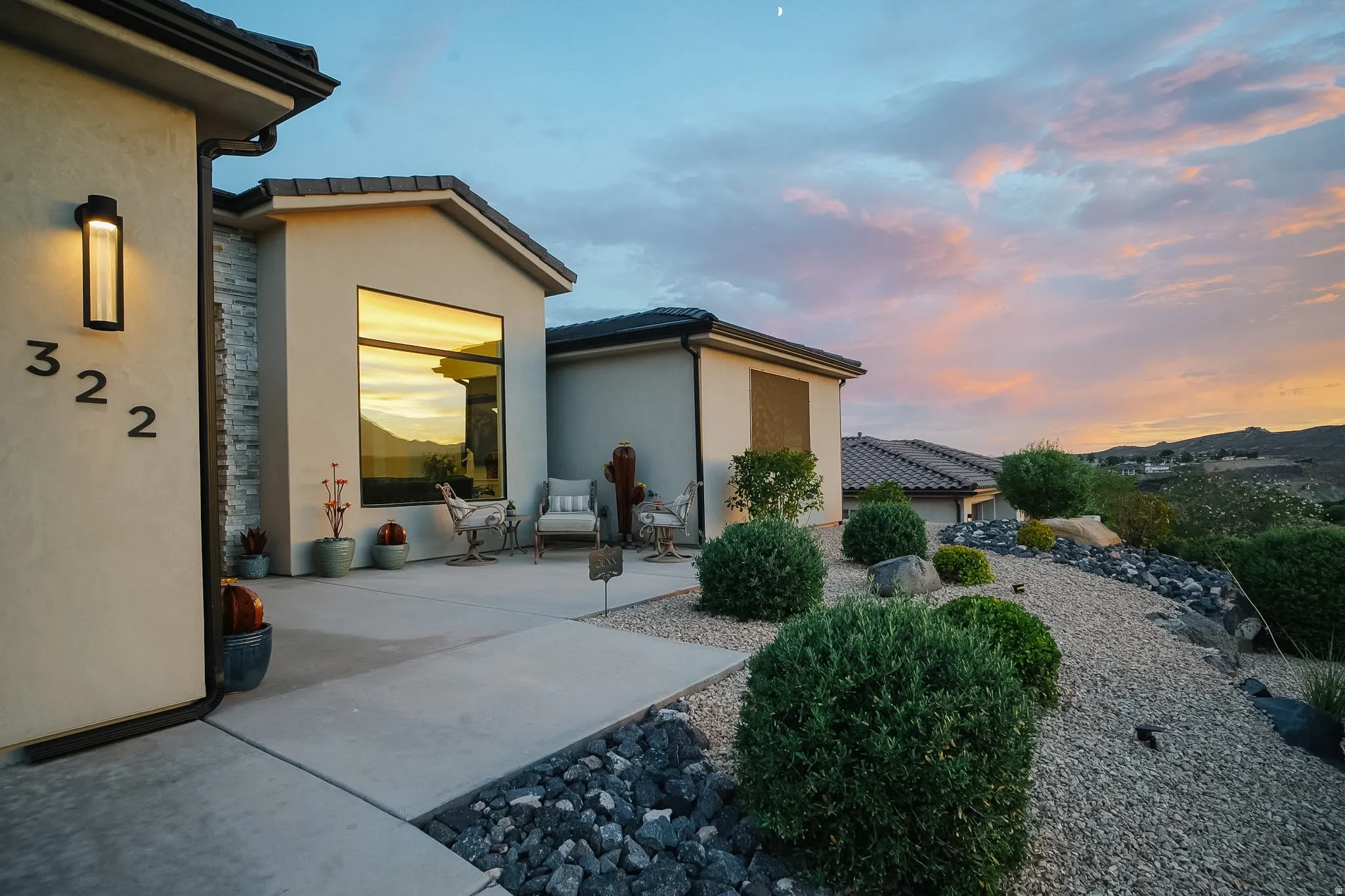 Modern stucco exterior with stacked stone accents