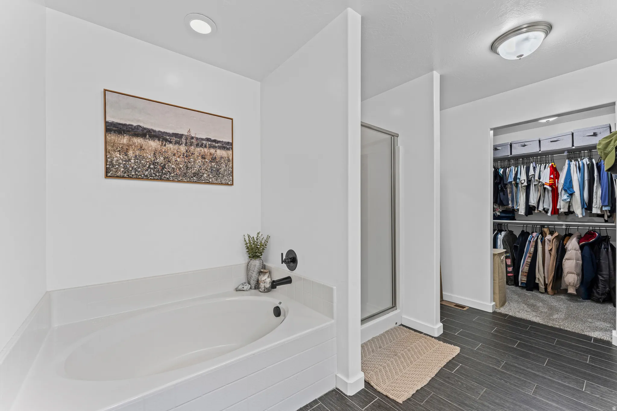 White built-in soaking tub with matte black fixtures