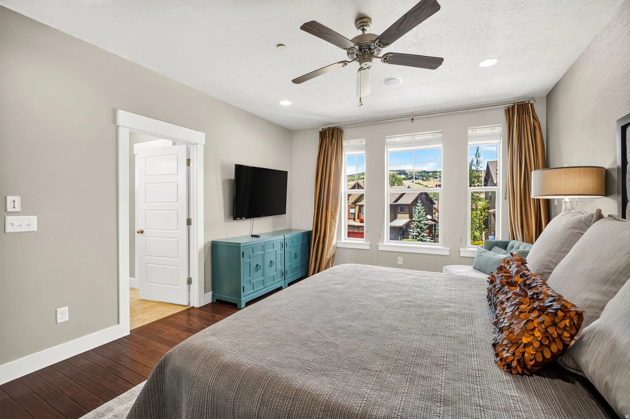 Bedroom featuring dark wood-finish flooring, recessed lighting, and a ceiling fan with integrated light
