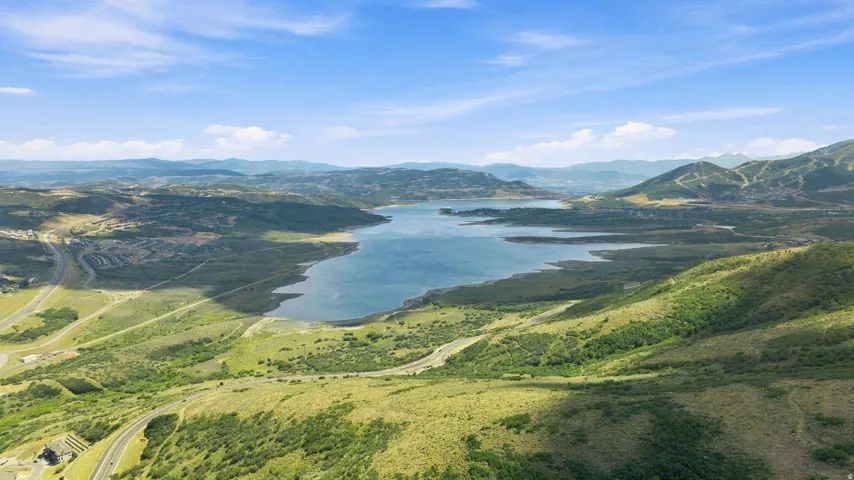 Expansive lake with surrounding mountainous terrain