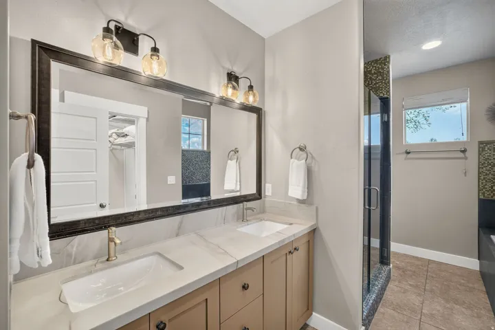 Dual vanity with undermount sinks and light-toned countertops
