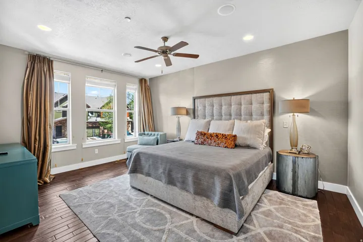 Bedroom featuring wood-finish flooring, recessed lighting, and a ceiling fan