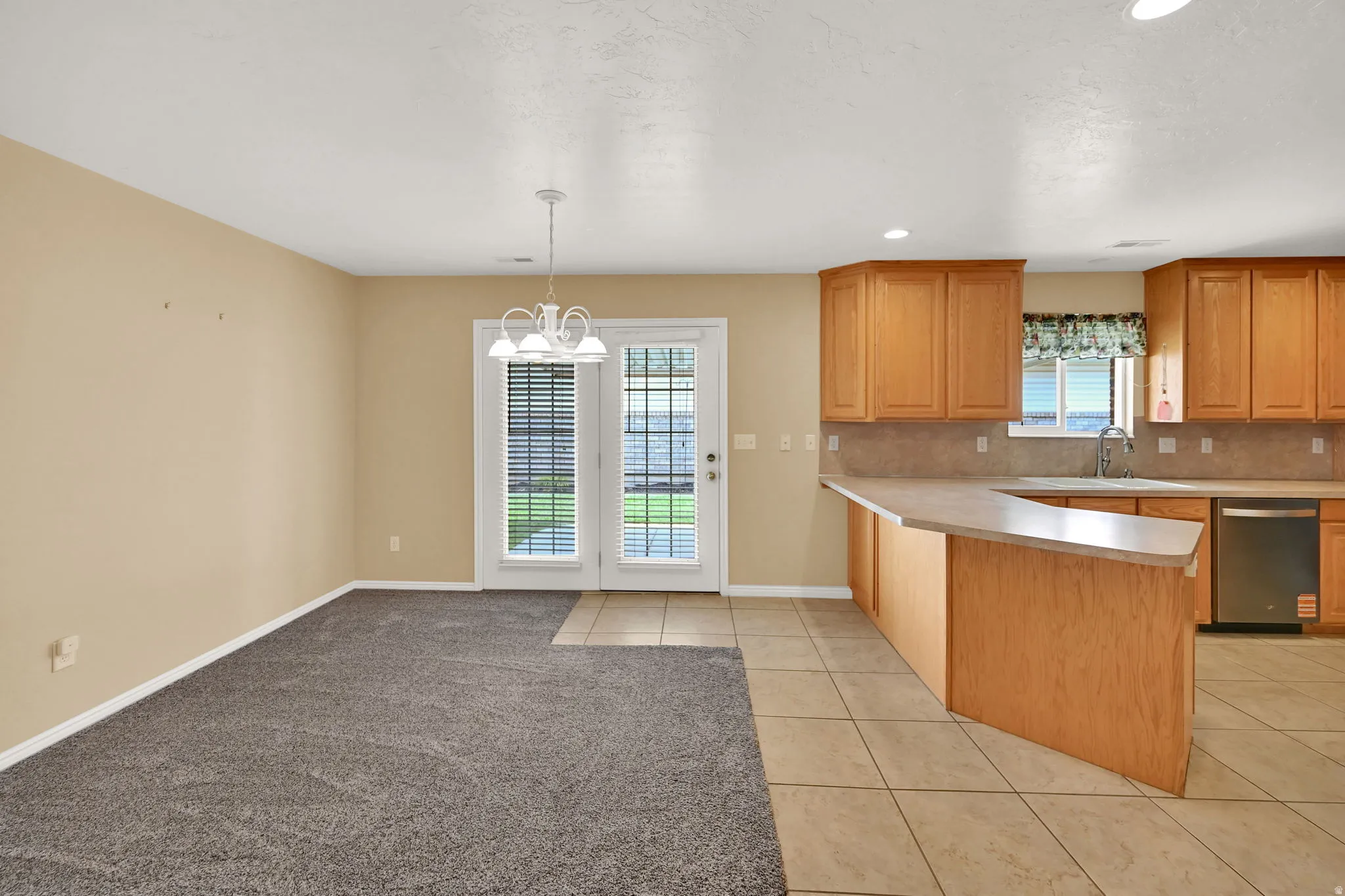 Open-concept kitchen and dining area featuring  a breakfast bar, and NEW stainless steel appliances