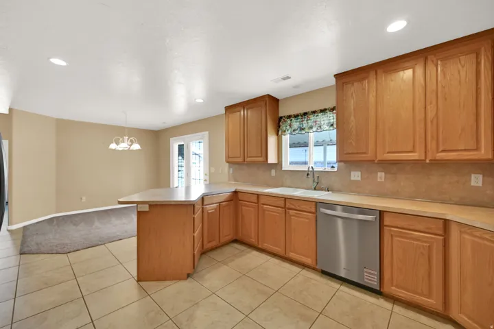 Spacious kitchen featuring NEW stainless steel dishwasher