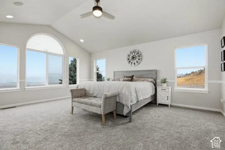 Vaulted ceilings featuring recessed lighting and a ceiling fan