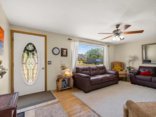 Entryway with wood-finish flooring and a decorative oval glass insert door