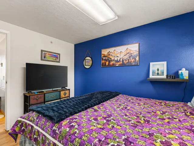 Interior room featuring a blue accent wall and white painted walls