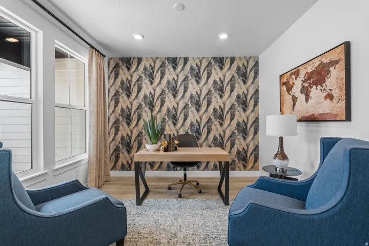 Room featuring a patterned accent wall, recessed lighting, and wood-finish flooring