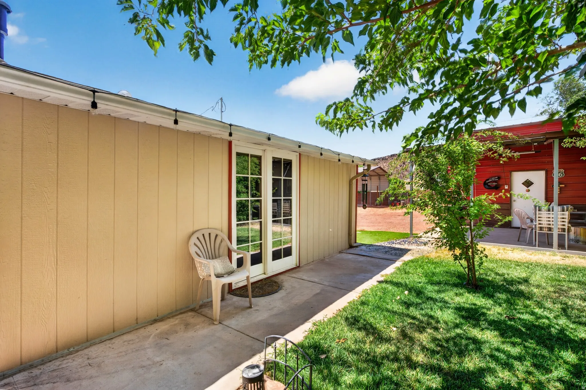 Patio area featuring concrete flooring and double pane French doors