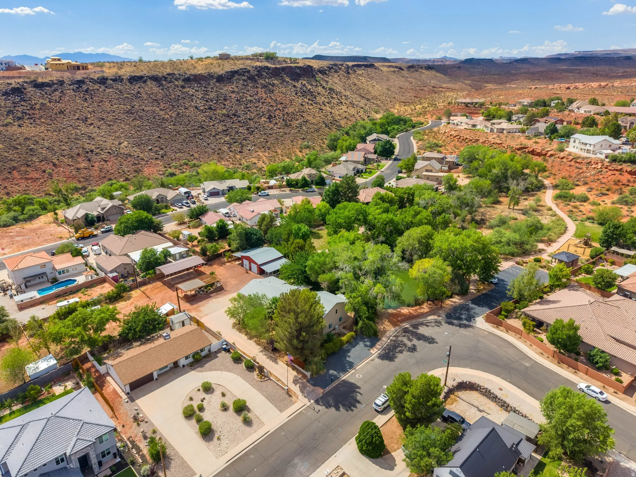 Aerial perspective showcasing residential properties nestled within a natural landscape