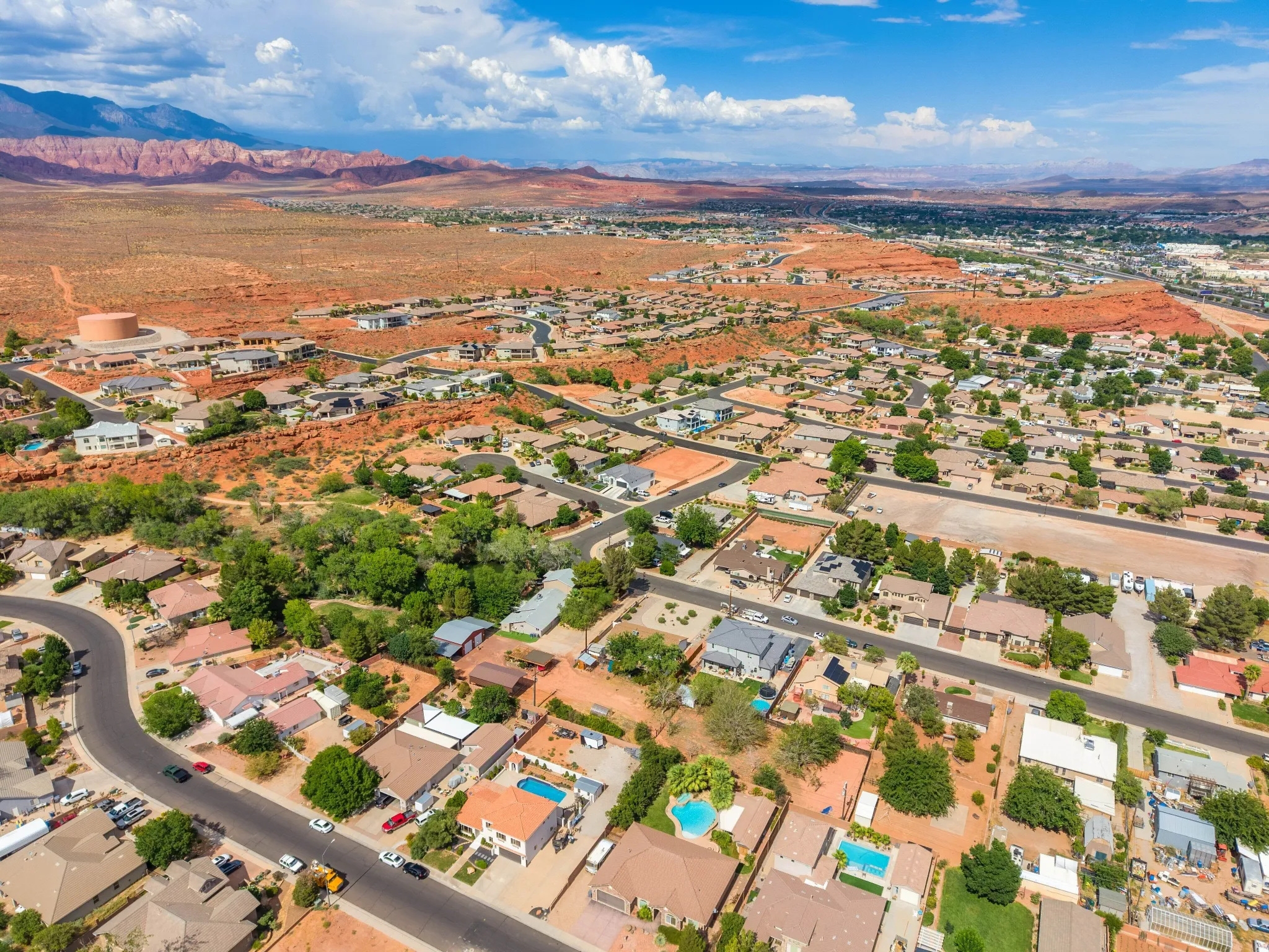 Expansive aerial perspective showcasing a residential community amidst a desert landscape