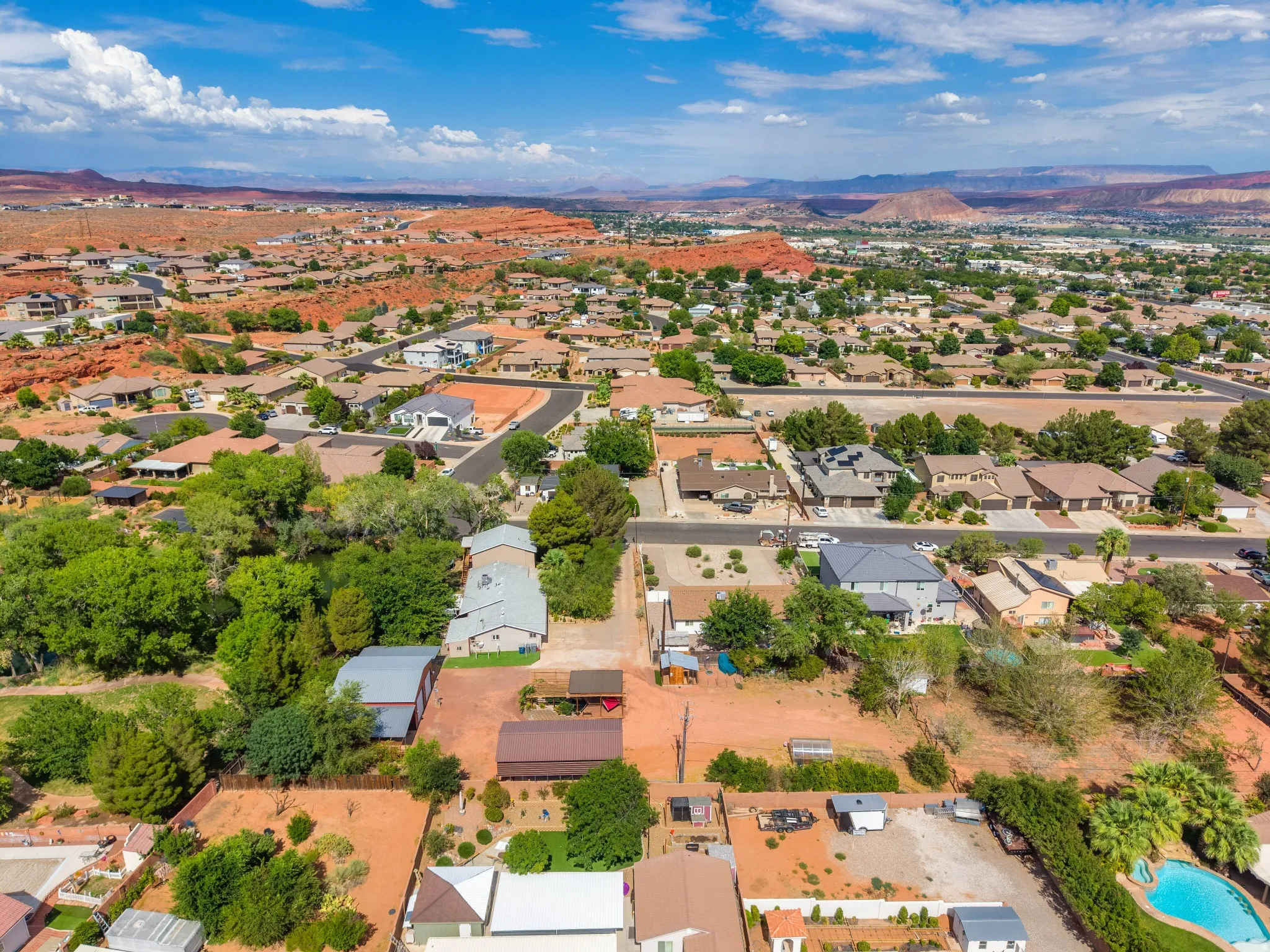 Aerial perspective showcasing a residential area with diverse landscaping