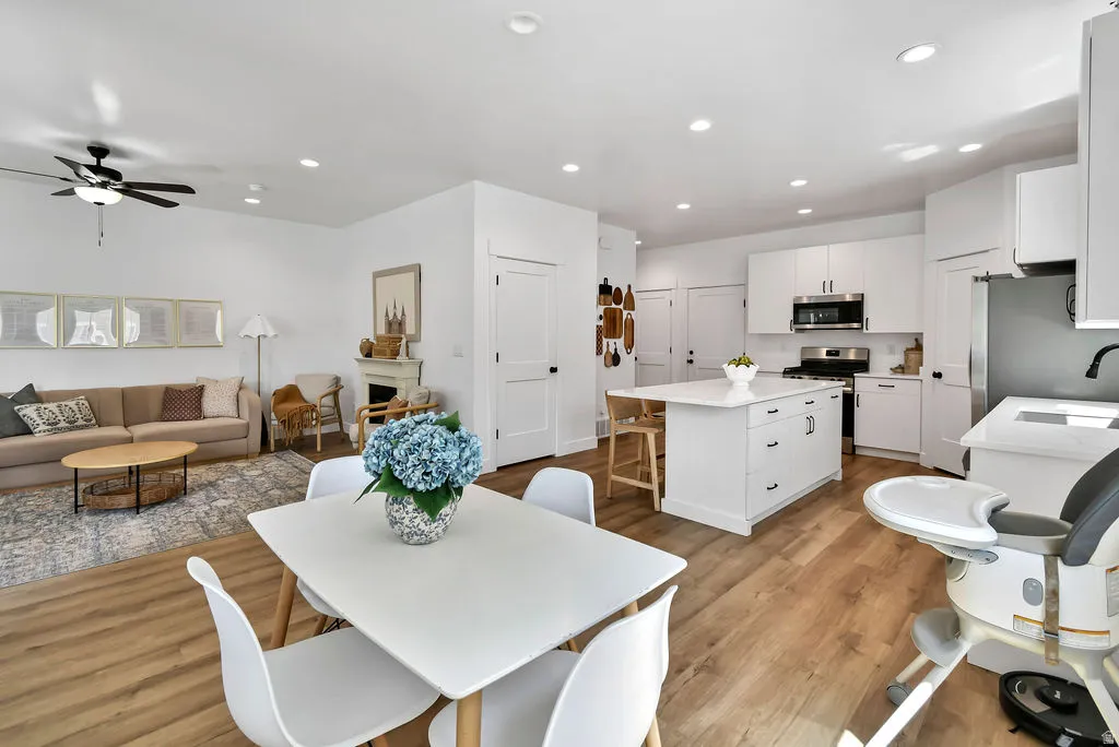 Open-concept living space with wood-finish flooring throughout