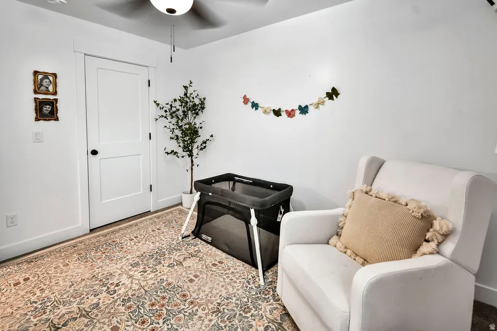 White interior walls with a two-panel door featuring a black knob