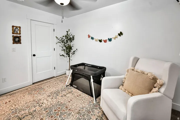 White interior walls with a two-panel door featuring a black knob