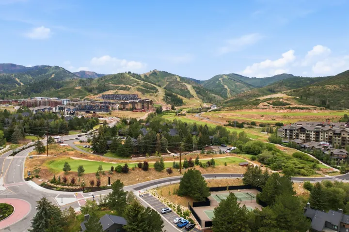 Expansive mountain landscape featuring residential communities, golf course, and tennis courts