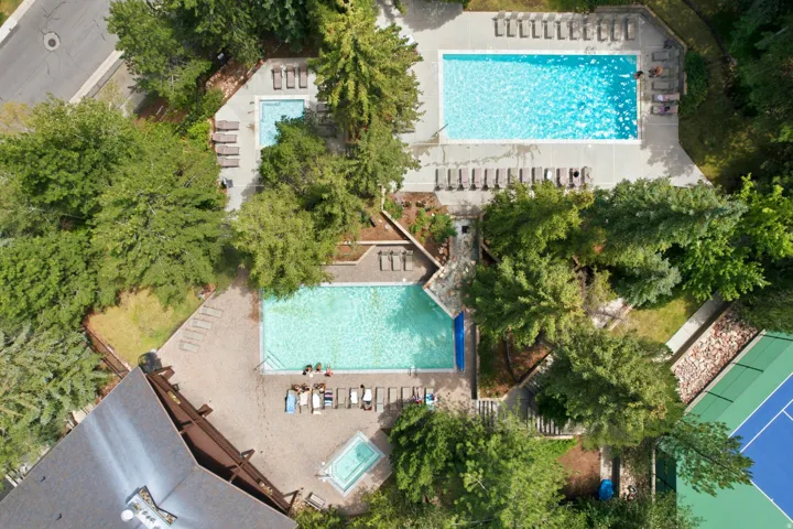 Community amenities featuring two swimming pools, a spa, and a tennis court