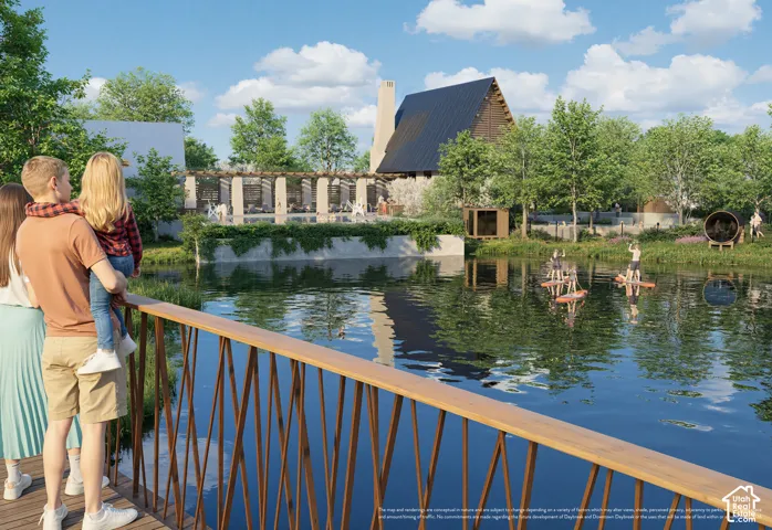 Waterfront setting with a wood-finish bridge and surrounding green space