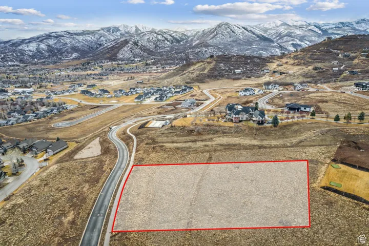 Expansive undeveloped lot featuring a paved roadway frontage