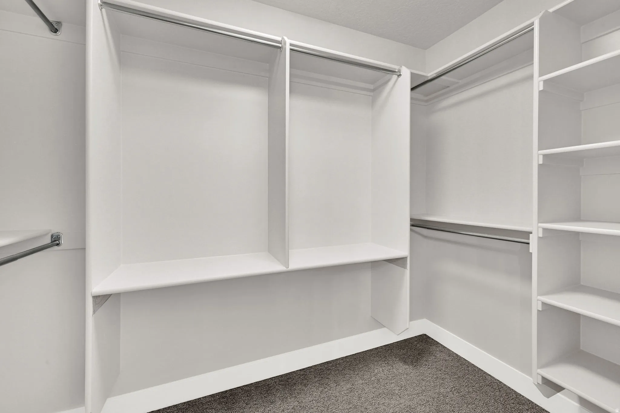 Built-in white shelving system with multiple compartments