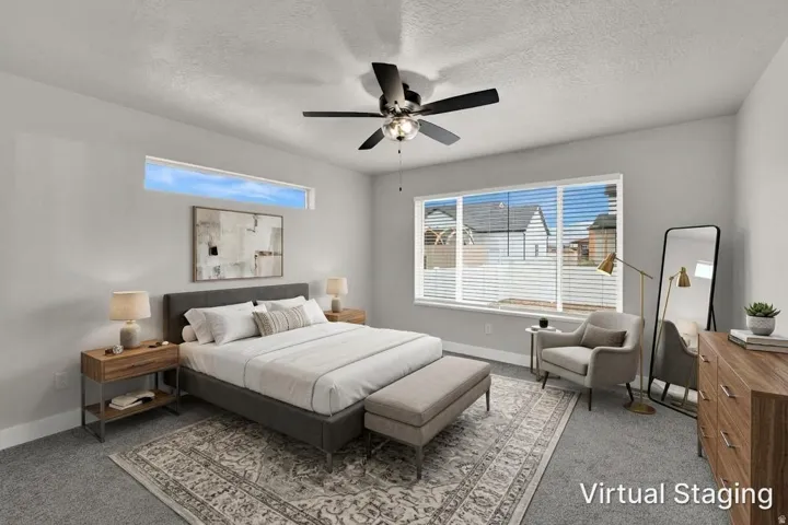 Wall-to-wall carpeting, a multi-pane window with blinds, and a built-in ceiling fan with integrated lighting