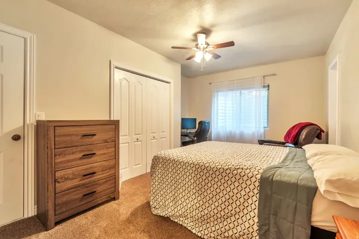 Room featuring light-colored walls and soft pile carpeting