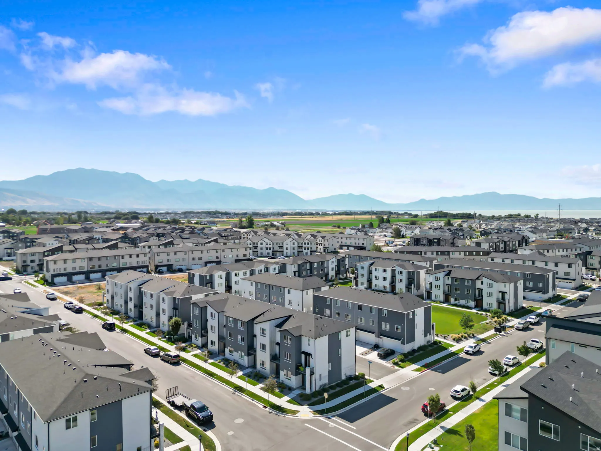 Contemporary residential community featuring multi-story buildings with a consistent architectural style