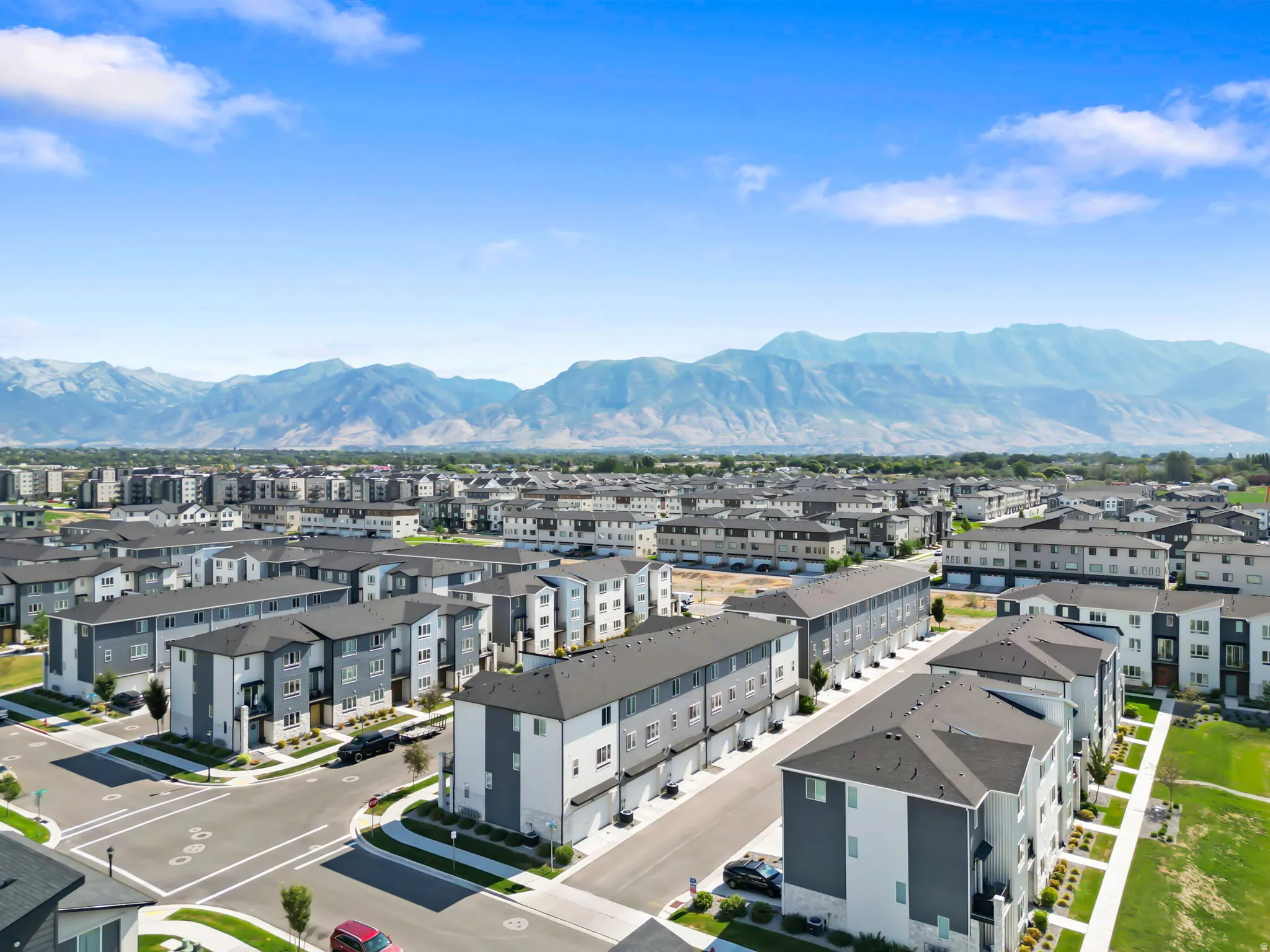 Expansive residential community featuring multi-story townhomes with contemporary exteriors