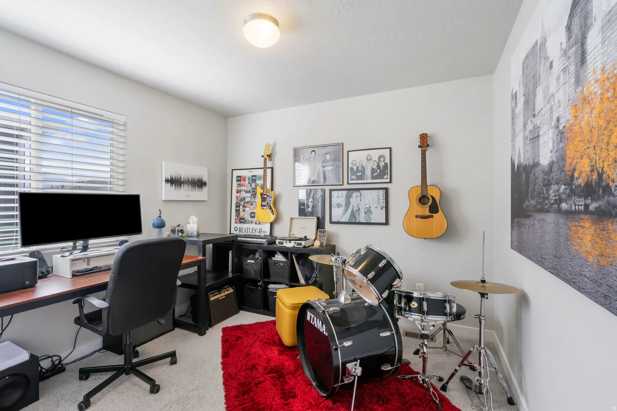 Versatile room with a window featuring horizontal blinds, light-colored walls, and a flush-mount ceiling light