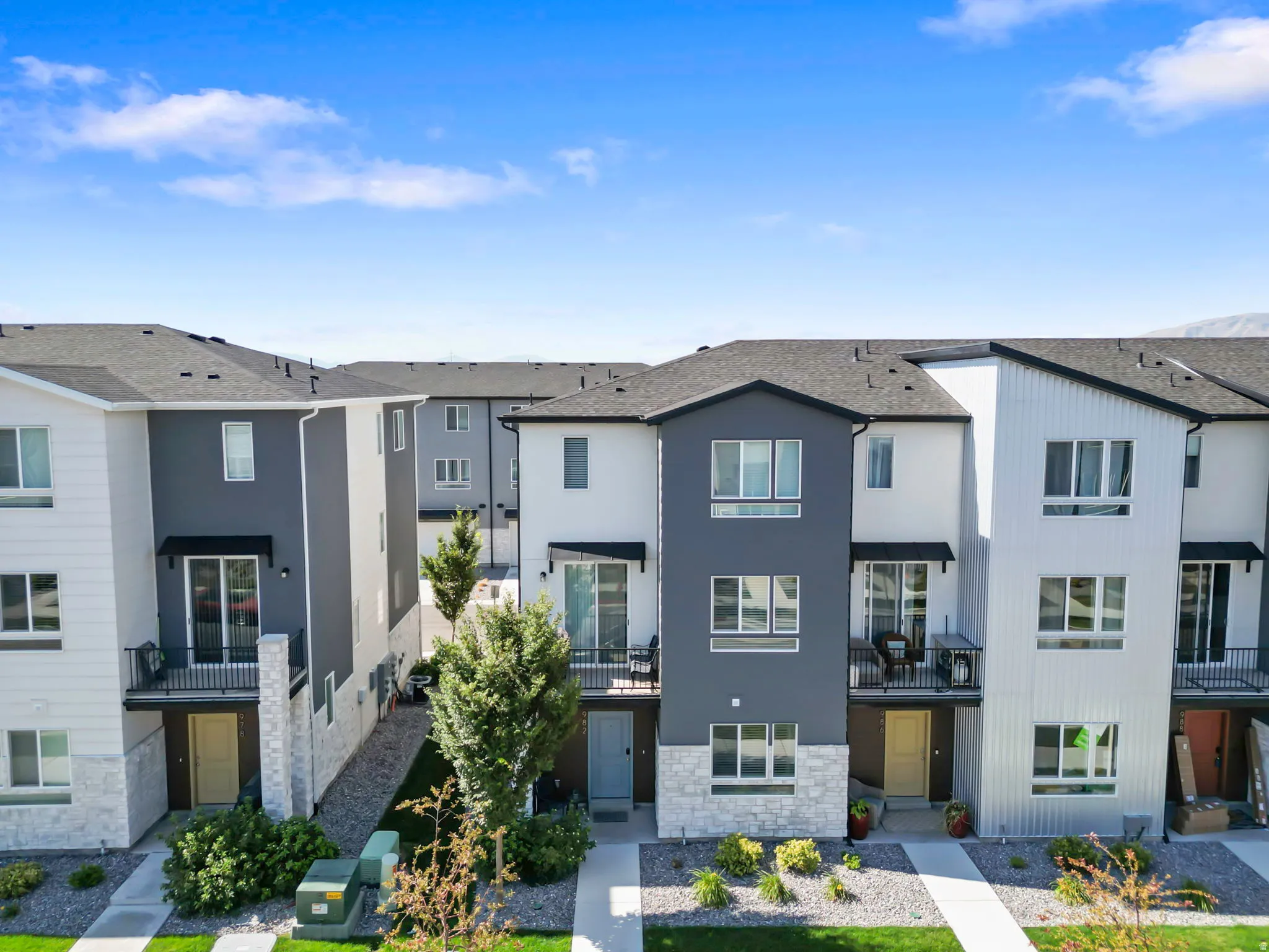 Modern townhome exterior featuring contemporary architectural design elements