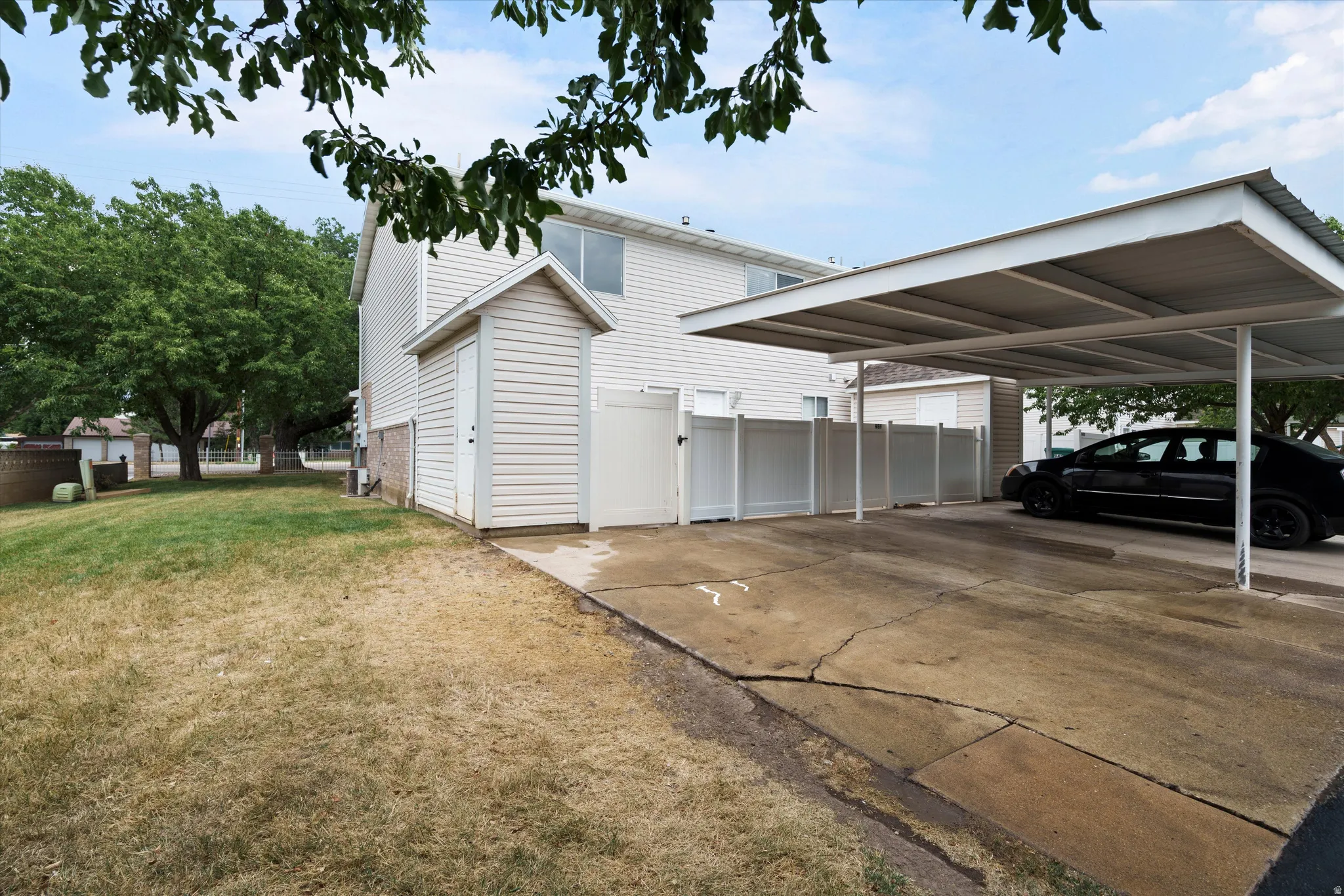 Parking right outside of fenced patio.