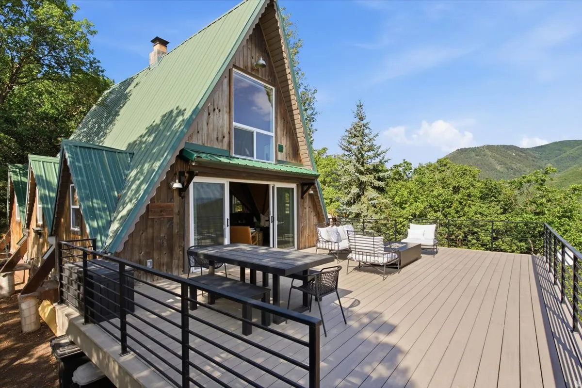 Expansive outdoor deck featuring composite decking and a modern black metal railing system
