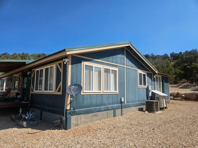 Exterior with blue siding and light trim