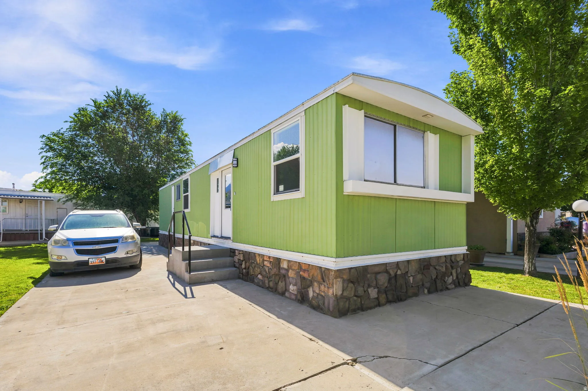 Lime green exterior siding with white trim