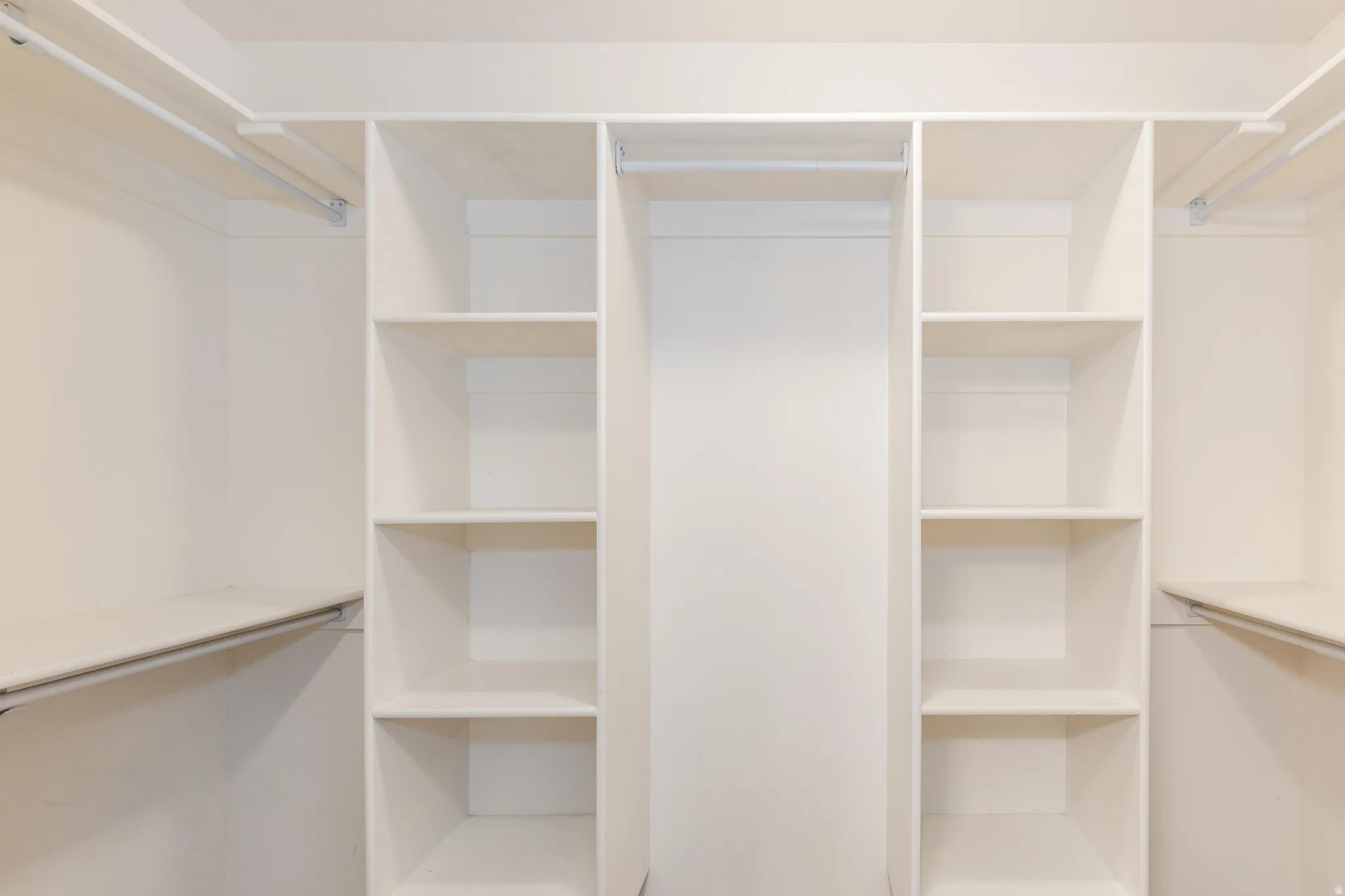 Built-in closet organization system featuring shelving and hanging rods