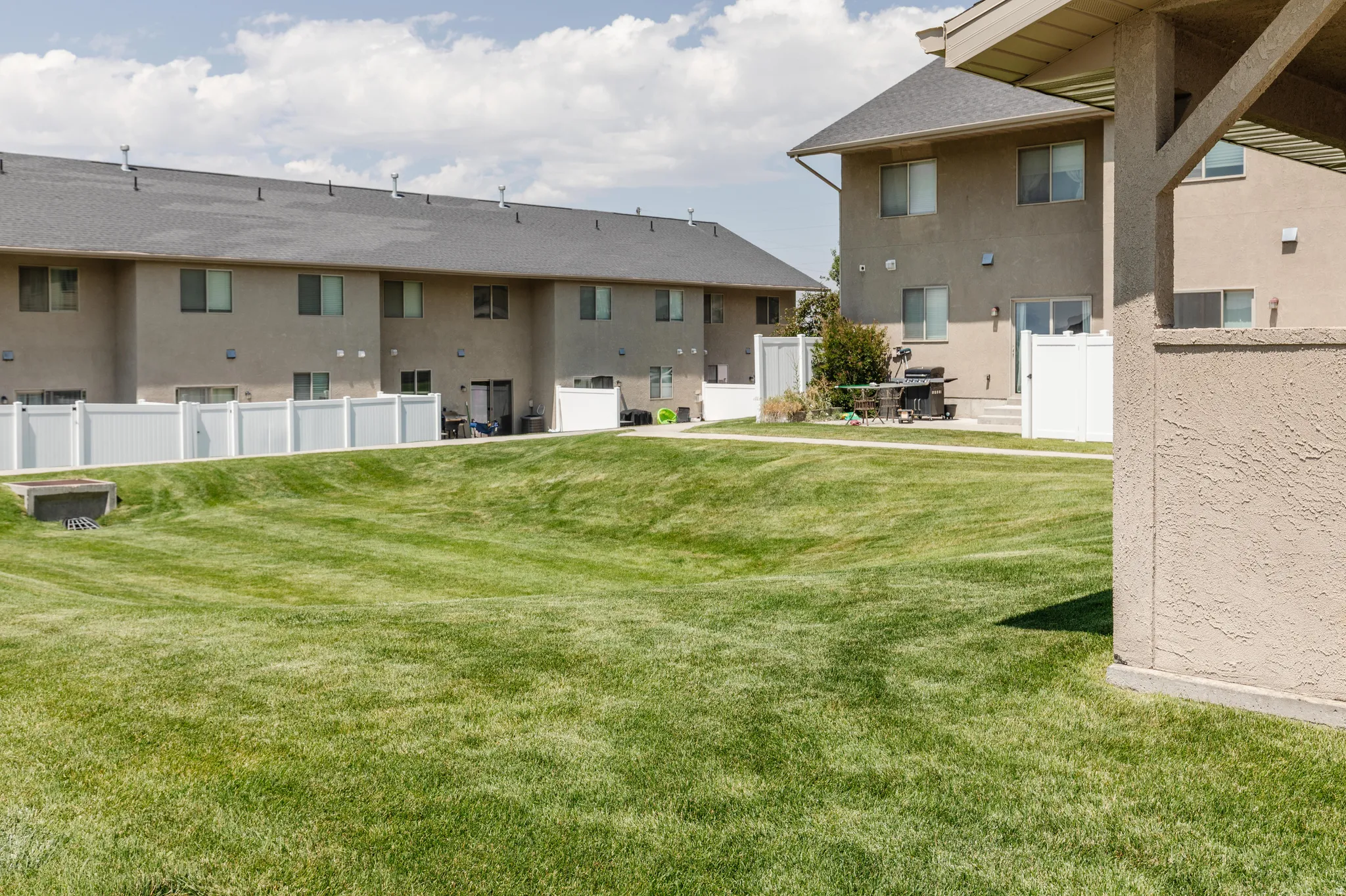 Expansive green space featuring a large manicured lawn