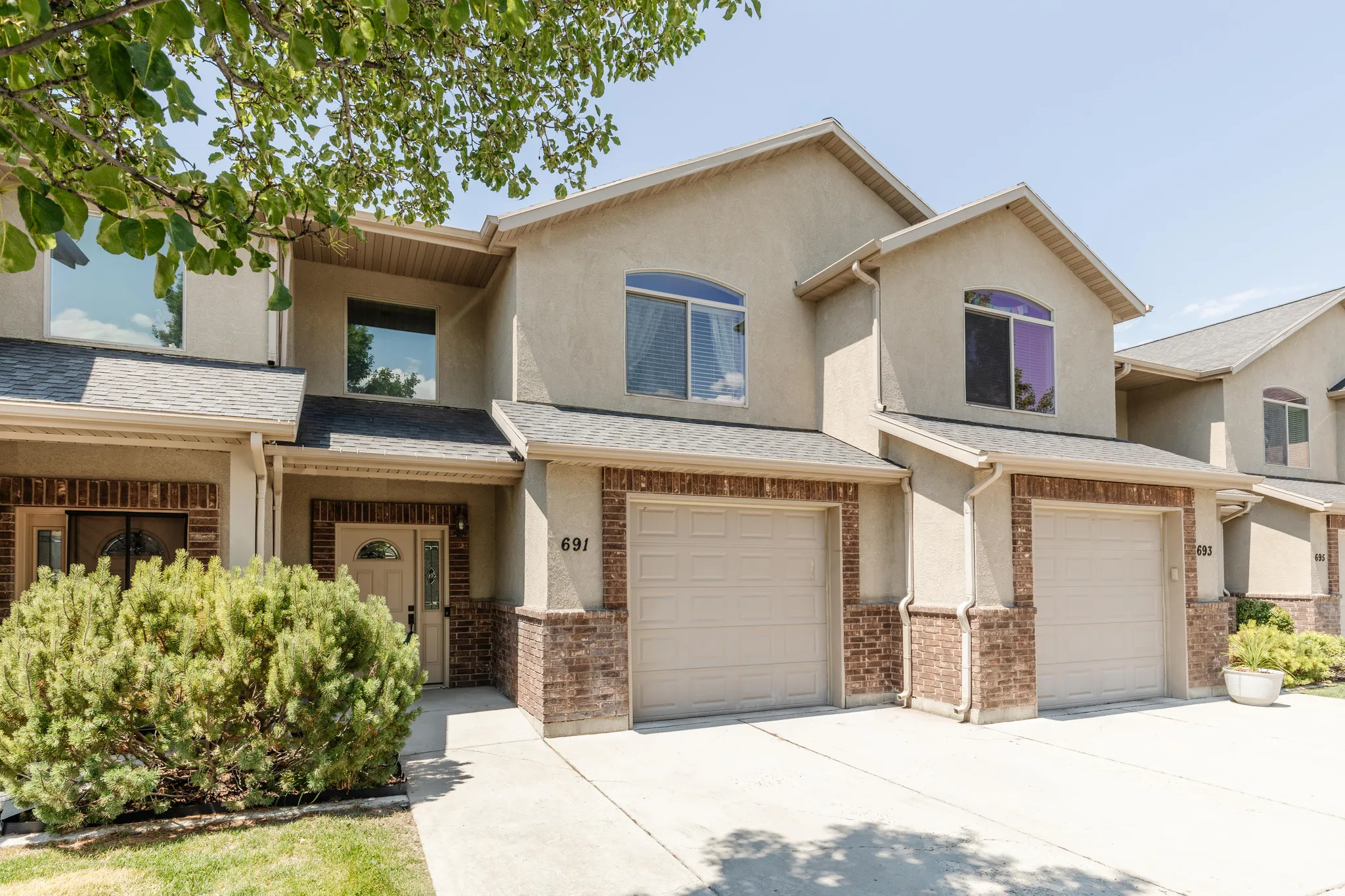 Stucco exterior with brick veneer accents
