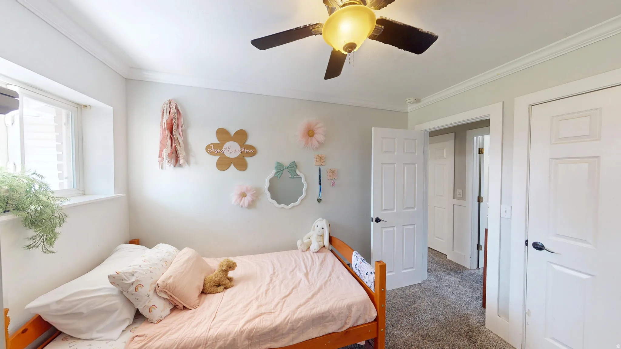 Bright room with light-toned walls and crown molding